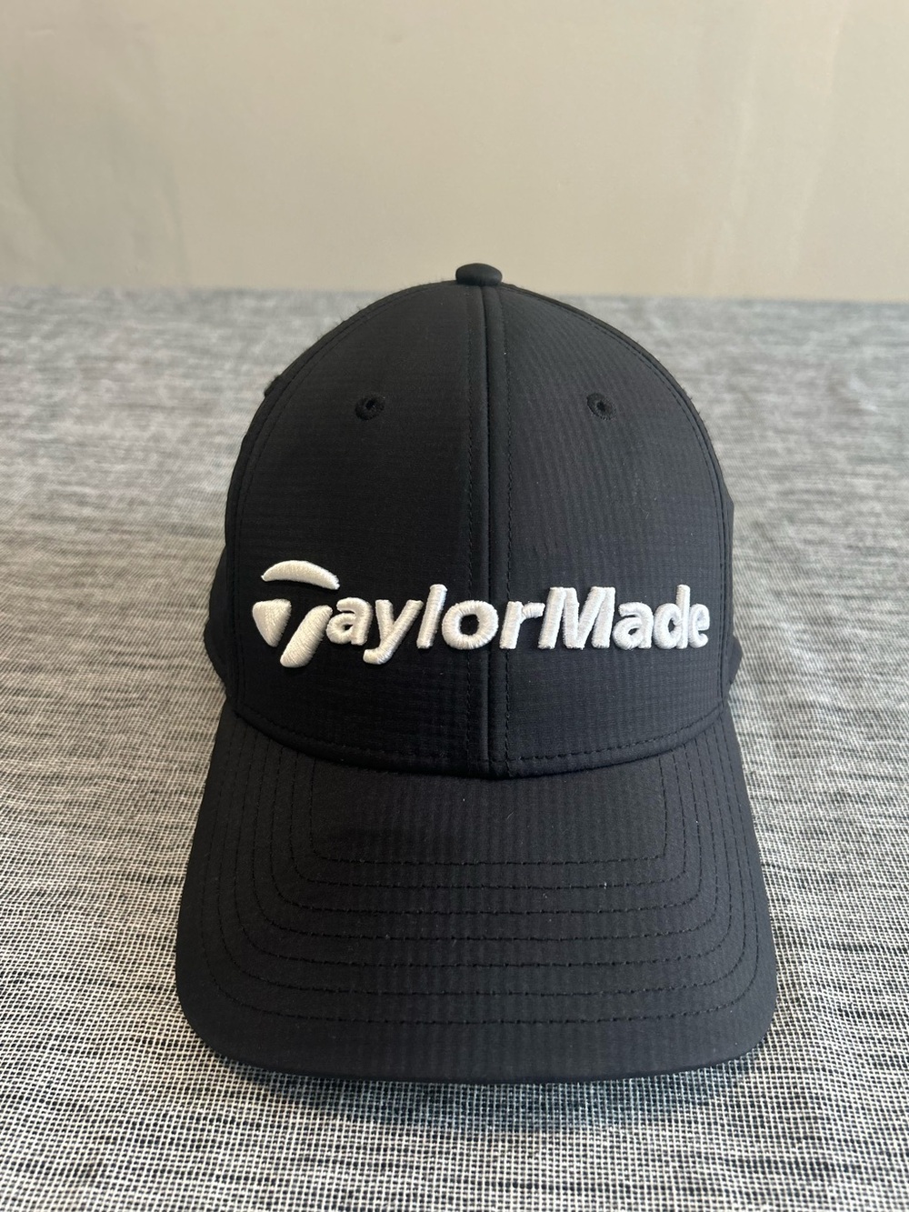 TaylorMade Black Hat with White Embroidered Logo. Adult Unisex
